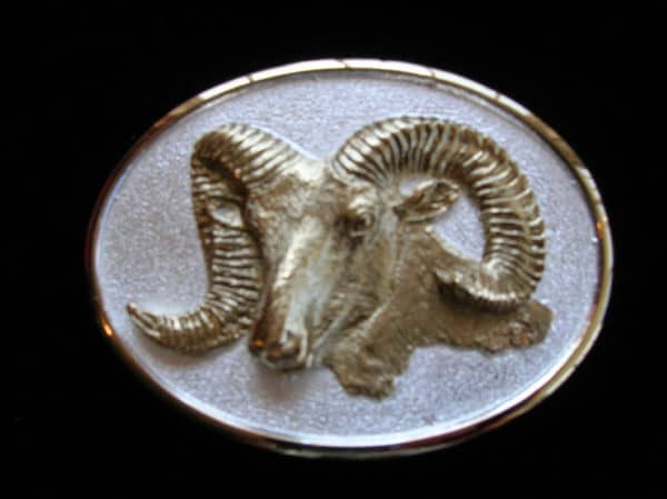 https://mlefktw0zcdo.i.optimole.com/w:600/h:449/q:mauto/f:best/https://donbeckbronzes.com/wp-content/uploads/2014/12/Bighorn_buckle_Gold_Silver-e1551300340350.jpg